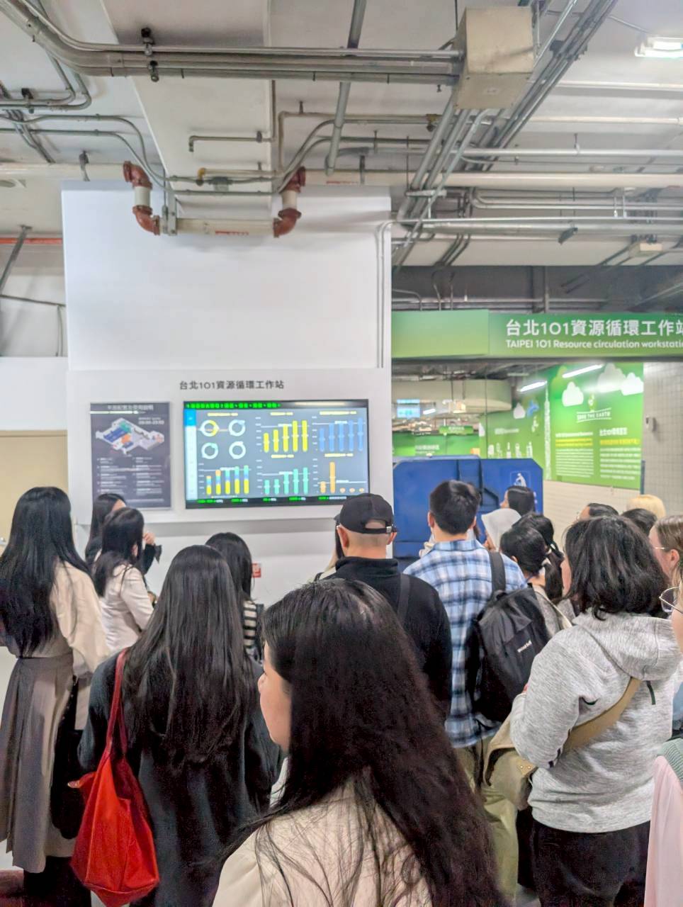 Students listen to a presentation in Taipei 101’s green-optimized waste development center
